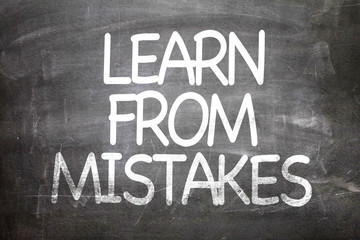 Obraz premium Learn From Mistakes written on a chalkboard