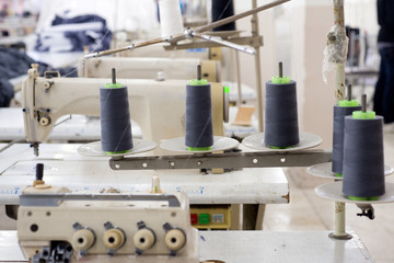 Tailors working in the sewing workshop using tailoring machine