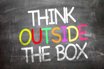 Think Outside the Box written on a chalkboard