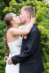 Bride and groom kiss