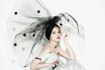 Fashion beautiful woman under the black veil