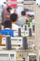 Tailors working in the sewing workshop using tailoring machine