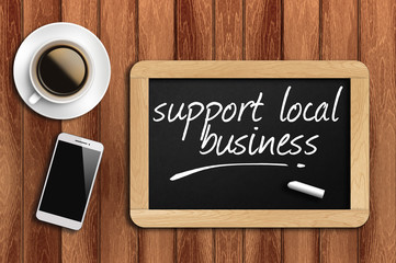 coffee, phone and chalkboard with support local business words