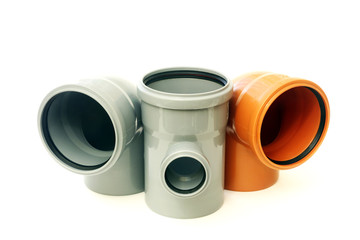 New gray and brown drain pipes, isolated on white