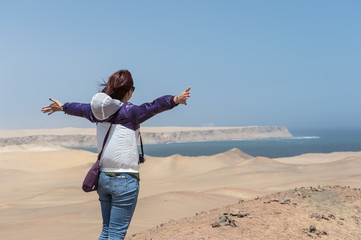 A Girl enjoy desert clift view point at the Paracus National Res