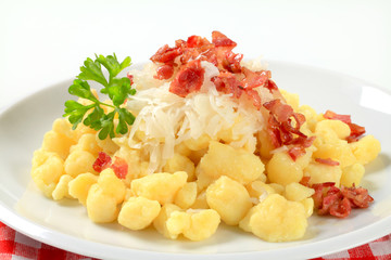 Small potato dumplings with bacon and cabbage