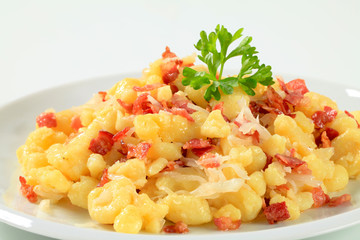 Small potato dumplings with bacon and cabbage