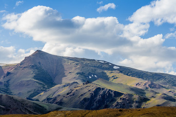 Highland landscape with blue shadows and clouds in Altai in summer