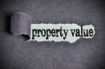 property value word under torn black sugar paper