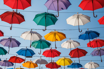 Fototapeta na wymiar Creative decorative background from color umbrella above the street in Antalya, Turkey