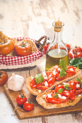 Italian starter, bruschetta with Sicilian red fresh tomato and m