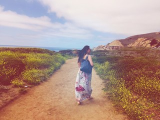 female walking to the beach