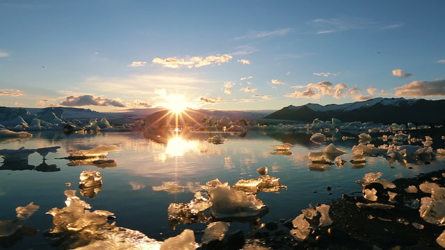 Vibrant Sunset over Iceberg Glacier Lagoon. Global Warming Concept. Jokulsarlon, Iceland.