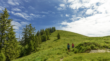 Fototapeta na wymiar Two hikers women walking in the mountains