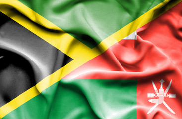 Waving flag of Oman and Jamaica