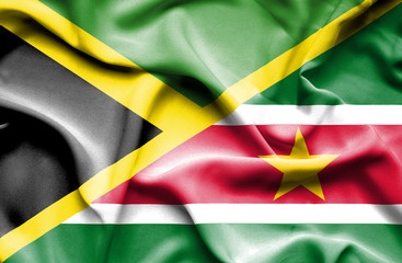 Waving flag of Suriname and Jamaica