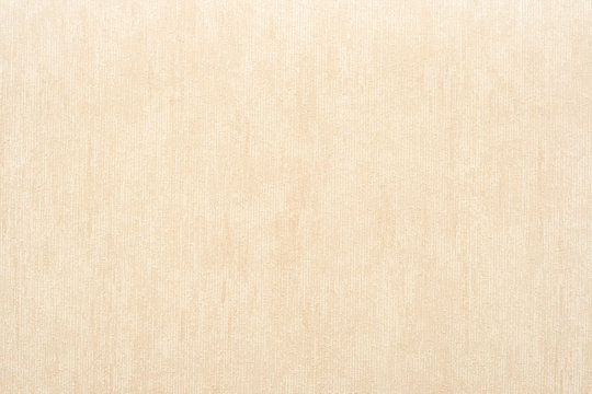 Vertical rough texture of vinyl wallpaper for abstract backgrounds of beige color