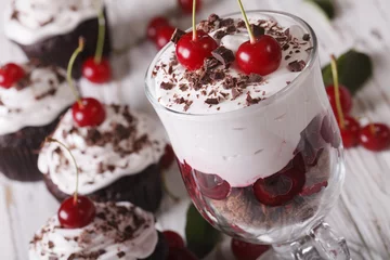 Gordijnen Black forest cherry dessert in a glass macro. horizontal © FomaA