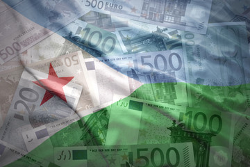 colorful waving djibouti flag on a euro money background