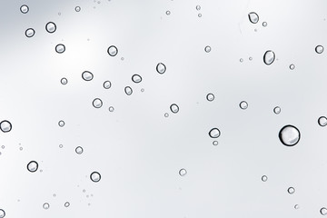 Water drop on glass mirror background.