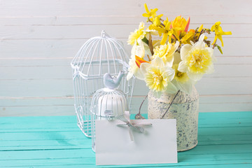 Background with fresh daffodils  and candles