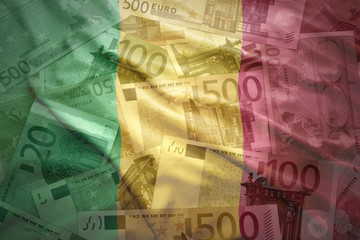 colorful waving malian flag on a euro money background