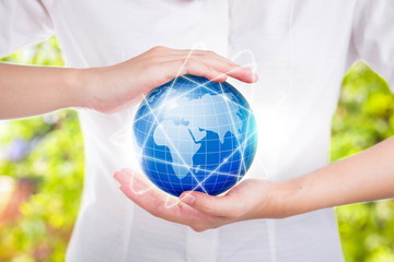 Female hands save environment keep in the world blue planet.