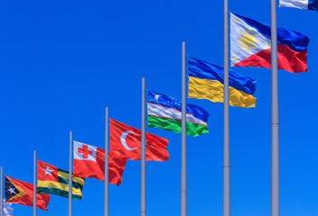 Flags against blue sky