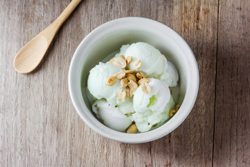 ice cream with peanuts in ceramic bowl
