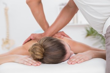 Obraz na płótnie Canvas Physiotherapist doing back massage 
