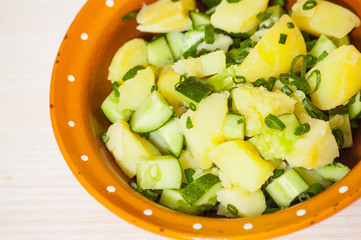 Potato salad with green onions and cucumber