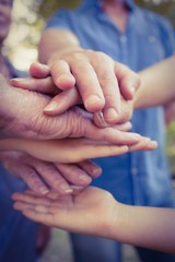 Family putting their hands together