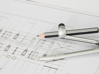 A stationery over blurred architectural blueprint of office buil