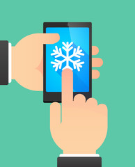 Man's hands using a phone showing a snow flake