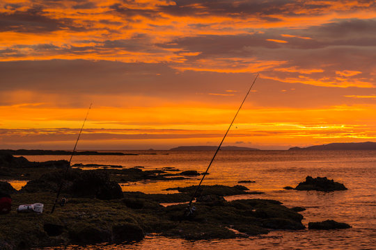 Surfcasting fishing rods and sunrise