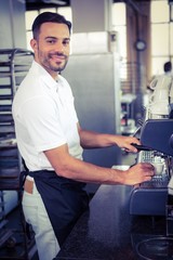 Fototapeta na wymiar happy worker making coffee