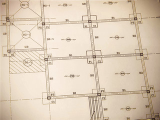 Architectural blueprint of office building with a pencils