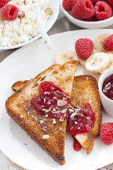 sweet breakfast - crispy toasts with fresh raspberries, banana 