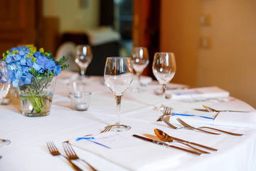 Table set in blue and white for wedding or event party.