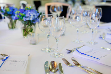 Table set in blue and white for wedding or event party.