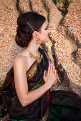 Girl with oriental make-up, indian sari and indian jewelry