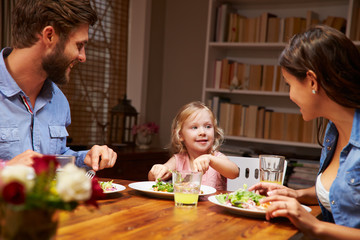 Family eating dinner at a dining table