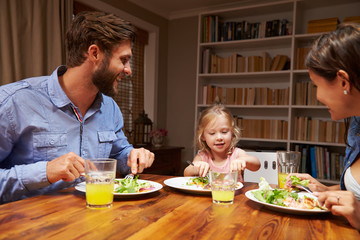 Family eating dinner at a dining table