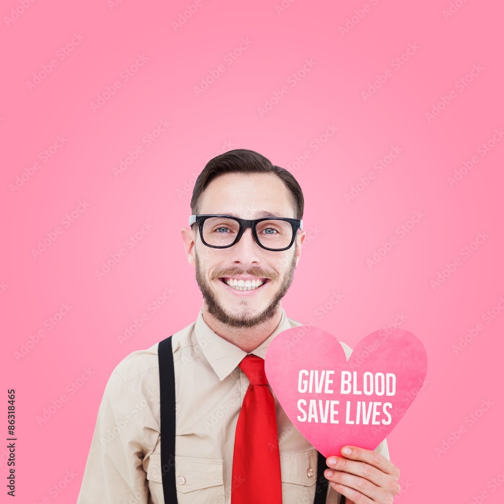 Poster composite image of geeky hipster smiling and holding heart card