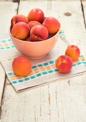 Fresh homegrown apricots on vintage white wooden table