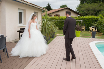 Happy Married couple near a swimming pool