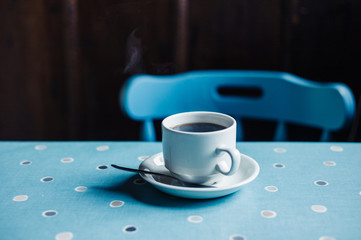 Cup of coffee on table in tearoom