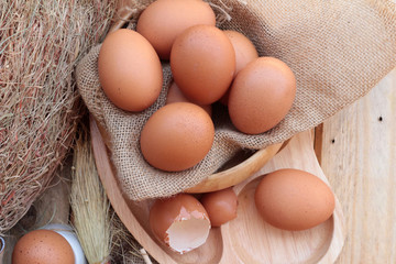 soft-boiled egg and eggs on wood background