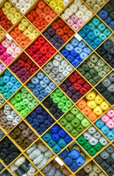 Yarns or balls and of wool are forming lovely colorful pattern