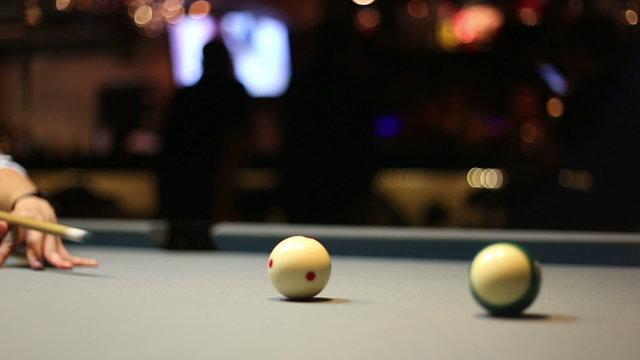 Playing pool billiards